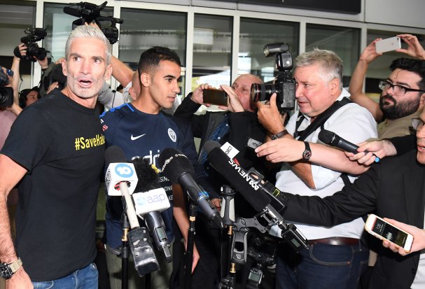 Craig Foster and media flank Hakeem al-Araibi on his return to Australia.