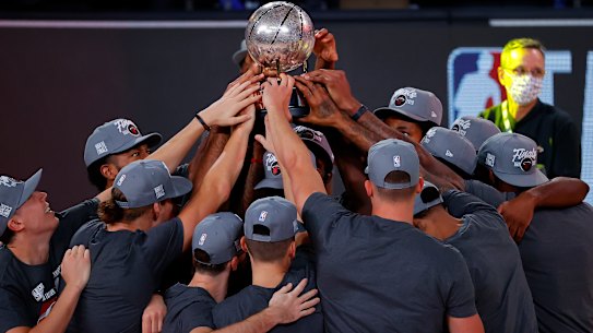 The Heat celebrate with their trophy.