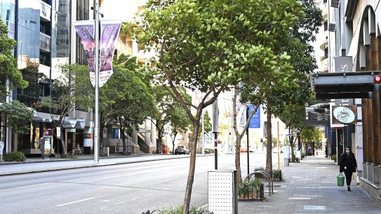 The main business strip of St Georges Terrace in Perth’s CBD is as barren as the eastern states’ cities since a mask mandate was brought in.  