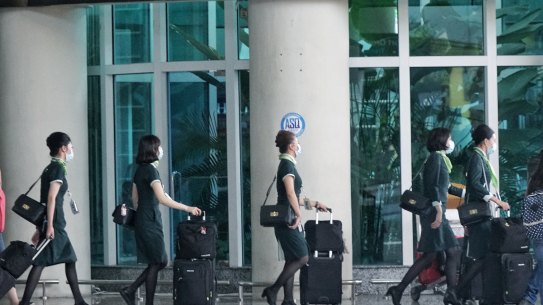 Flight crew arrive at Denpasar airport in Bali earlier this week.