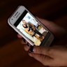 Iuliana Triscaru with her brother Beniamin Farcas in a photograph shown on her sister-in-law Lara's phone.