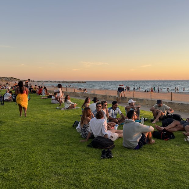 A multicultural mecca: locals and visitors gather at Wilson Park to watch the sun dipping into the Indian Ocean.