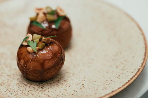 Brioche doughnuts are filled with chicken liver parfait at Omen.