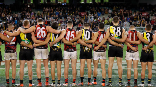 Richmond and Essendon players line up together at Dreamtime at the 'G last year.