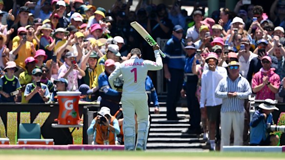 Changing of the guard: Usman Khawaja salutes the crowd after his final Test innings.