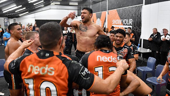 David Nofoaluma celebrates with his teammates following the win against the Dragons, four days after he left training hungover.