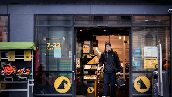 Life goes on in Denmark as a customer exits a supermarket in Copenhagen. 