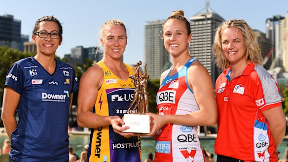 Prize fighters: Sunshine Coast Lightning head coach Noeline Taurua, captain Laura Langman, NSW Swifts captain Paige Hadley and head coach Briony Akle pose with the Super Netball trophy.