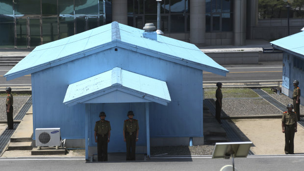 North Korean soldiers stand guard at the truce village.