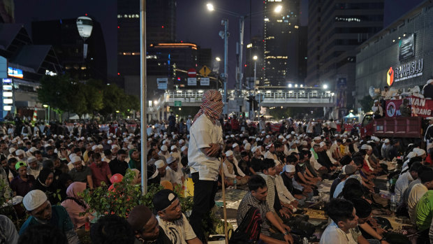 Demonstrators pray during their protest, which is being held during Ramadan.