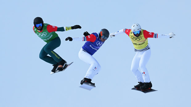 Cameron Bolton of Australia, Merlin Surget and Loan Bozzolo of France compete during the Men’s snowboard cross quarter-finals on Thursday.