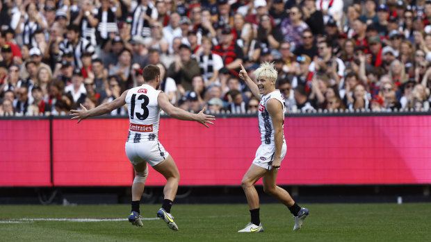 Jack Ginnivan celebrates a goal with teammate Taylor Adams.