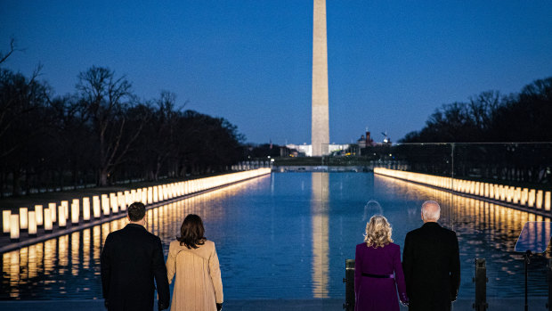 US President-elect Joe Biden, from right, wife Jill Biden, US Vice-President-elect Kamala Harris and husband Douglas Emhoff stand at the Lincoln Memorial Reflecting Pool on the eve of the inauguration. 