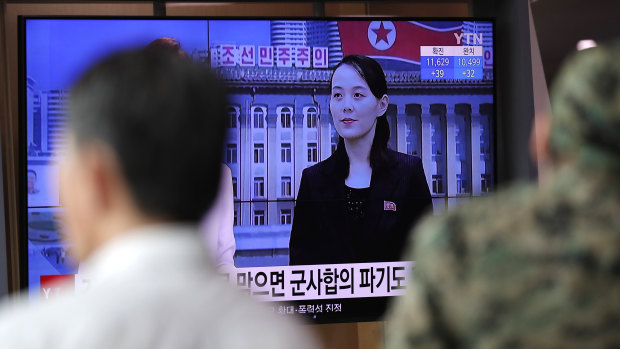 A man watches a TV news program with a file image of Kim Yo-Jong, the powerful sister of North Korea's leader Kim Jong-un, at the Seoul Railway Station in Seoul.