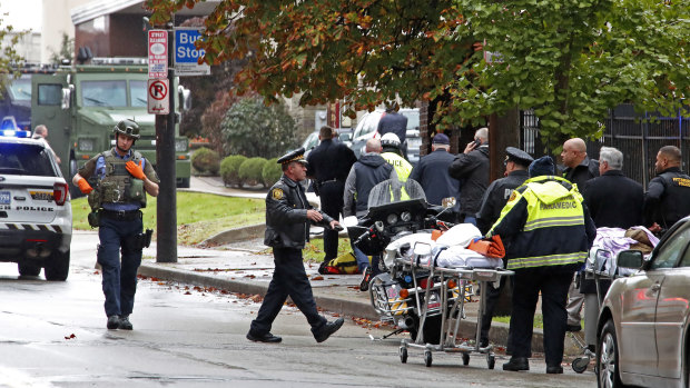 Emergency services rush to the scene of the shooting to help the wounded. 