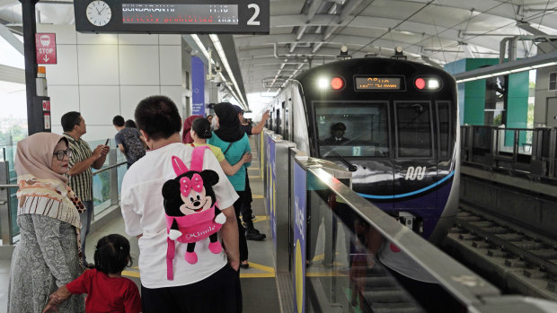 Passengers on Jakarta's new Mass Rapid Transit (MRT) system, which began operation this month.