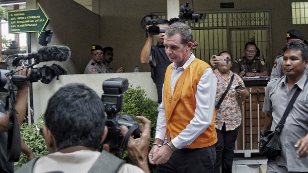 Johnsson taken to court room for his first trial at Denpasar district court.