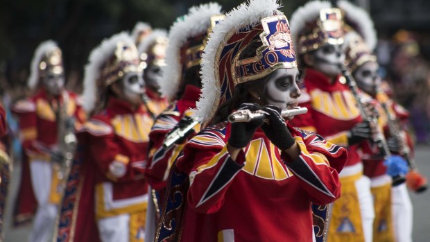 Performers participate in the Day of the Dead parade in Mexico City, last month.