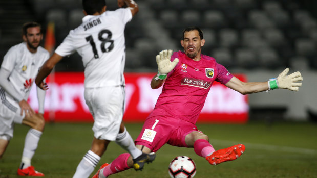Eight is enough: Sarpreet Singh beats Mariners keeper Ben Kennedy to score Wellington's eighth goal.