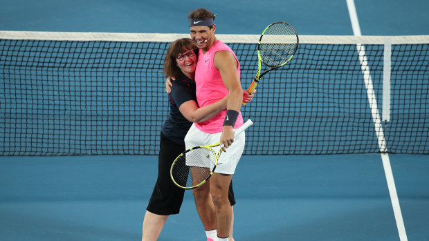 Ms Borg hugs Nadal during a game of mixed doubles.