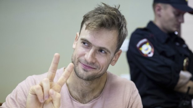 Petr Verzilov, a member of the feminist protest group Pussy Riot, gestures during hearings in a court in Moscow, Russia in July.