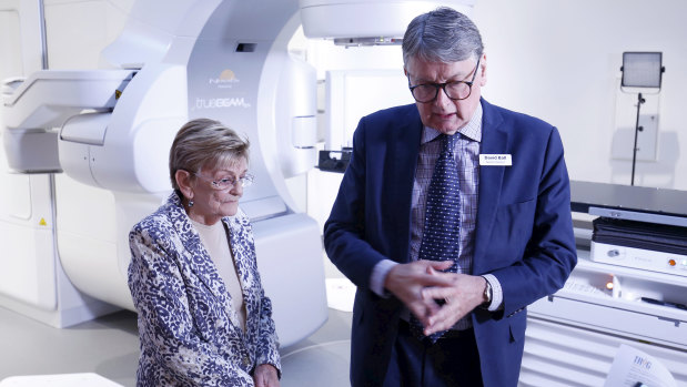Professor David Ball and Maureen Chrul with the machine that allowed her to be treated for stage one lung cancer in only four visits, compared to over 30. 