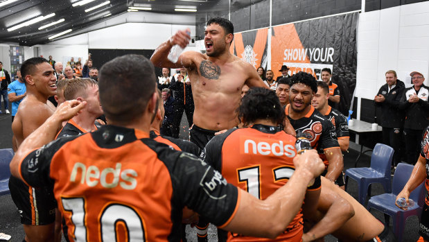 David Nofoaluma celebrates with his teammates following the win against the Dragons, four days after he left training hungover.