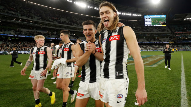 Nick Daicos and Darcy Moore celebrate after their side’s win over the Blues recently.