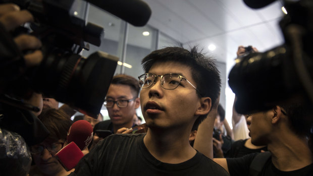 Joshua Wong addresses protesters on Monday.