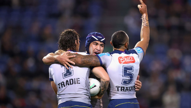 Nicho Hynes, Jahrome Hughes and Josh Addo-Carr celebrate another Storm try.