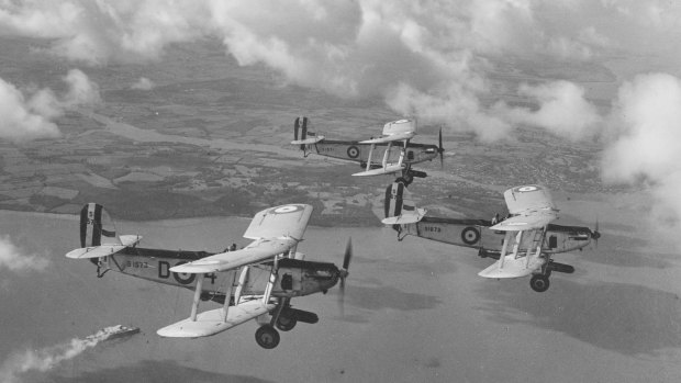 Royal Air Force biplanes flying in formation.