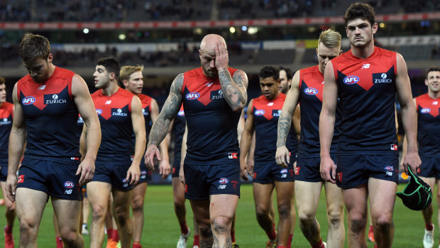 Nathan Jones of the Demons leads his players from the ground after their loss to Collingwood.