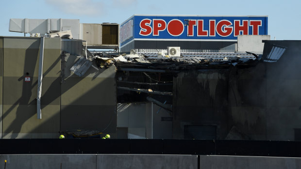 Damage to the Spotlight store at DFO after a plane crash that killed all five on board.