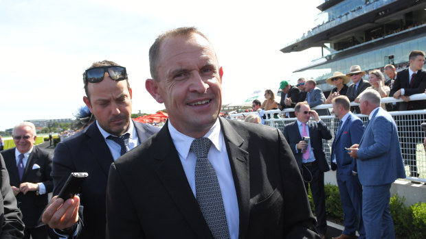 Relieved: Chris Waller affords himself a smile in the mounting yard.