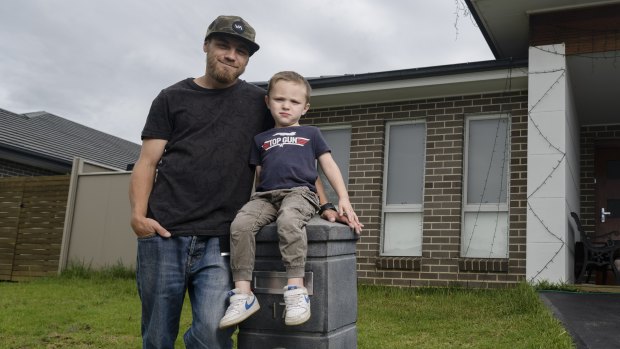 Matthew Wood with his son at home in Sydney.