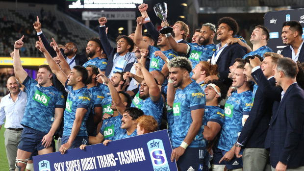 Skipper Patrick Tuipulotu holds up the trophy after the Blues broke their title drought.