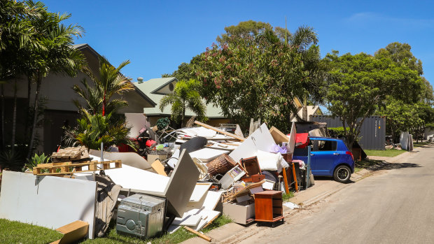Damaged household possessions were piled up on the footpath in Idalia in the flooding aftermath.