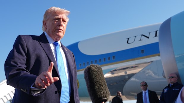 US President Donald Trump speaks to reporters in Palm Beach on Monday.