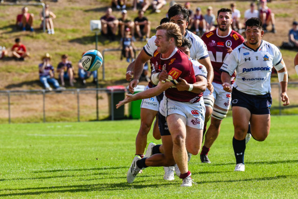 Harry McLaughlin-Phillips offloads for the Queensland Reds.