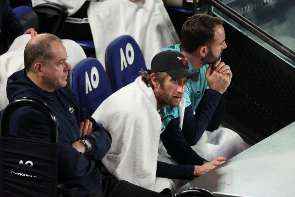 Medvedev’s coach Gilles Cervara looking on.