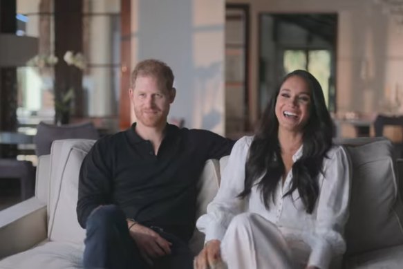 Harry and Meghan laughing in this screenshot from the Harry & Meghan documentary.