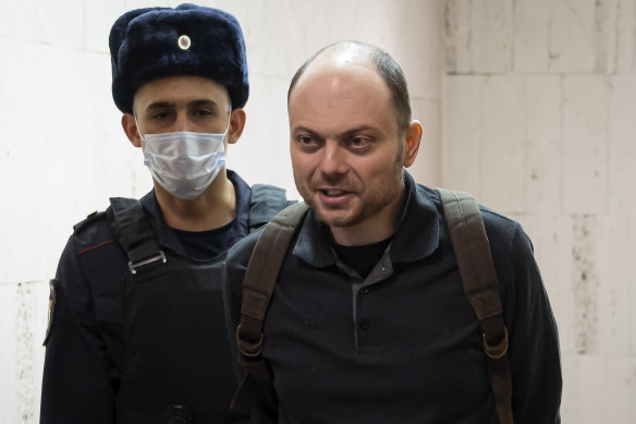 Russian opposition activist Vladimir Kara-Murza is escorted to a hearing in a court in Moscow in 2023.