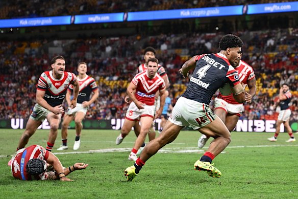 Robert Toia scores a try against the Dolphins on Friday night.