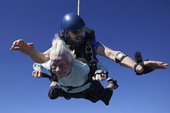 Dorothy Hoffner, 104, falling through the air with tandem jumper Derek Baxter.