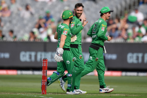 Seb Gotch, Glenn Maxwell and Clint Hinchliffe of the Stars celebrate a wicket during the Big Bash League match between the Melbourne Stars and the Perth Scorchers at the MCG on Saturday.