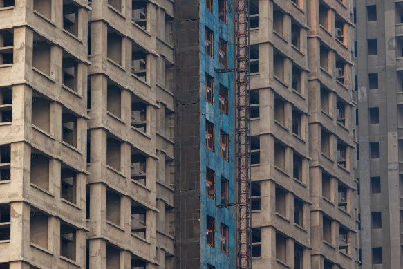 Some home buyers moved into the unfinished apartments because they have nowhere else to live.