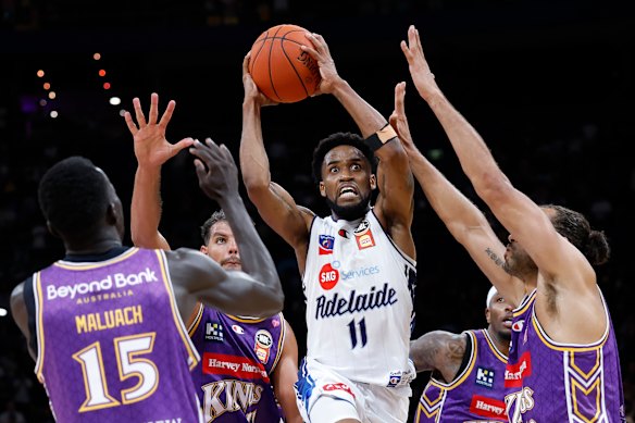 Bryce Cotton is crowded out by Kings players.