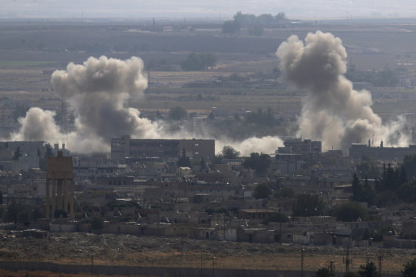 Smoke and dust billows from targets in Ras al-Ayn, Syria, caused by bombardment by Turkish forces. 