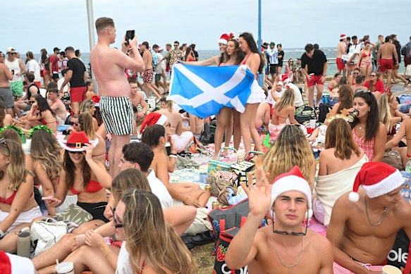 A group display a Scottish flag at Coogee Beach on Thursday afternoon. 