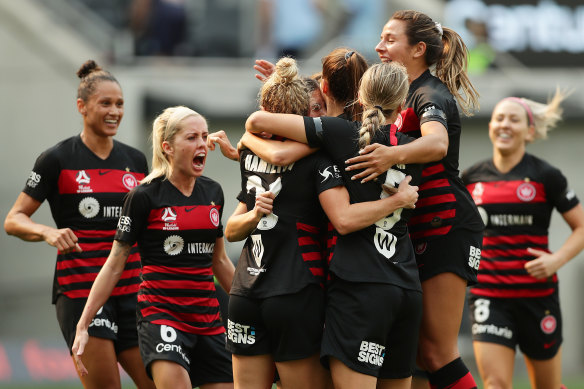  The Wanderers celebrate after Amy Harrison’s fourth-minute opener set them on the way to victory over Sydney FC. 